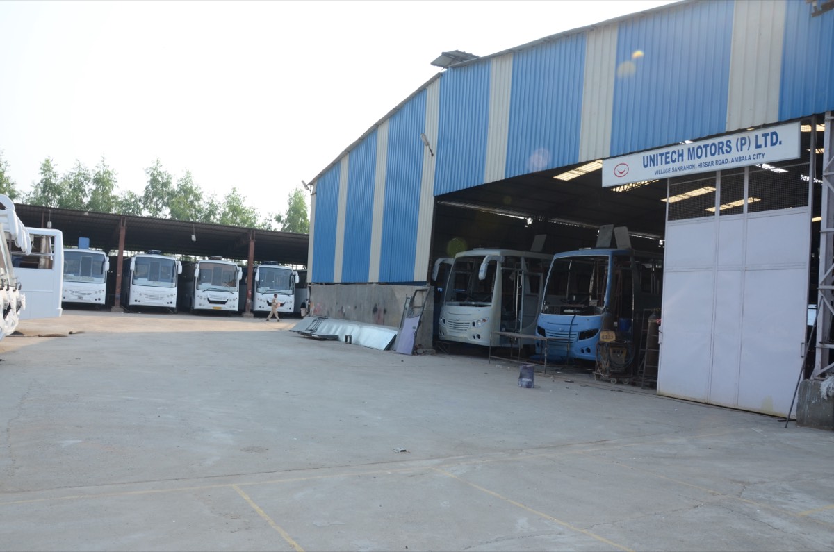 Factory yard with buses at various build stages