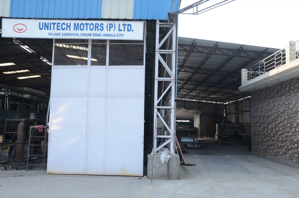Workshop entrance with plant signboard