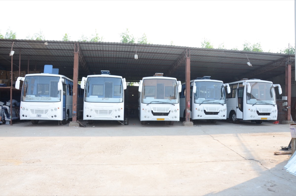 Five finished Unitech Motors buses lined up ready for dispatch