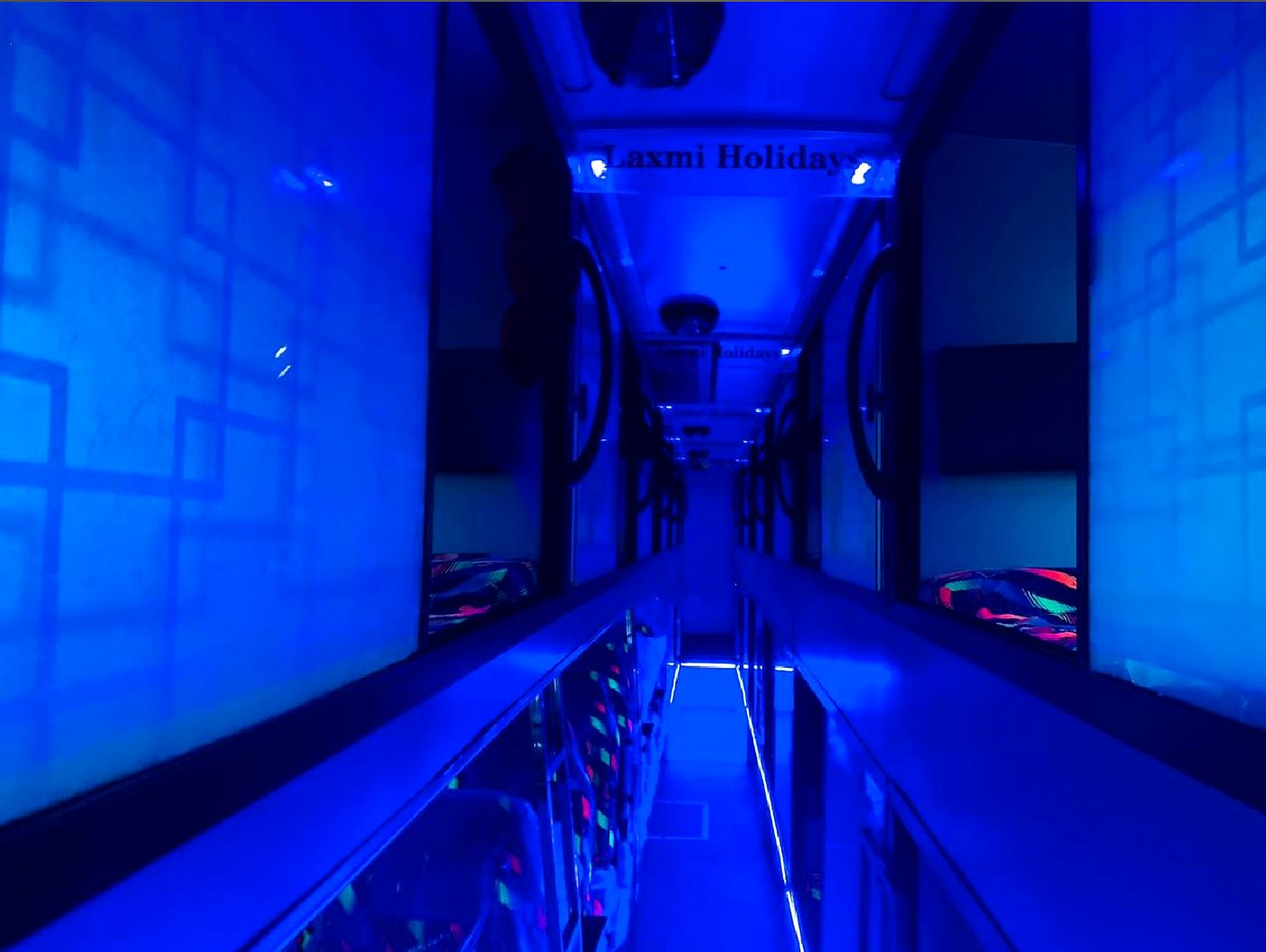Laxmi Holidays — aisle under mood lighting